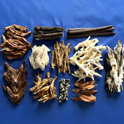 The contents of the bag laid out on a blue background, with each type of treat grouped together
