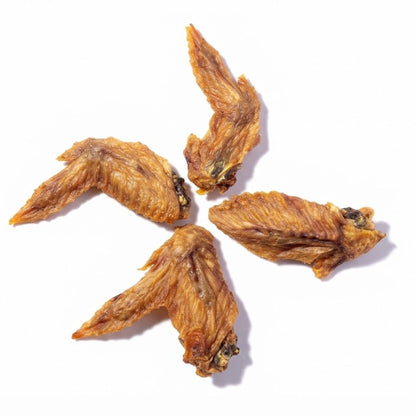 Four air-dried turkey wing tips for dogs on a white background