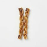 Two natural braided beef tendon chews for dogs on a white background