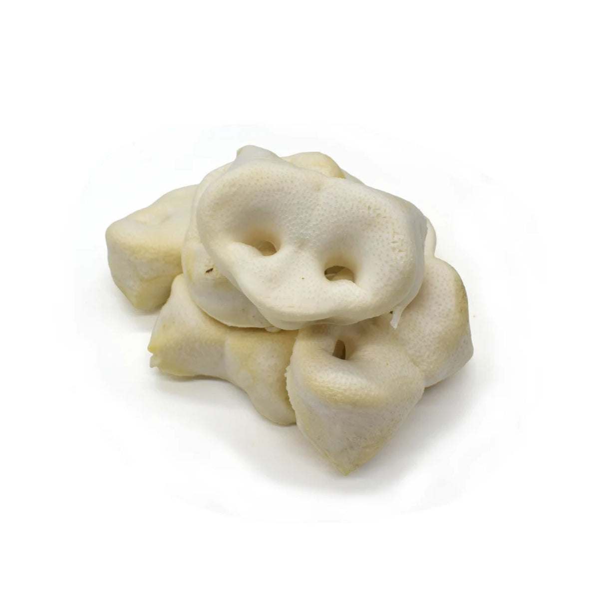 A pile of puffed pig snouts for dogs on a white background