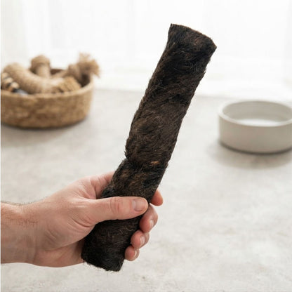Hand holding a furry buffalo wrap to show its size