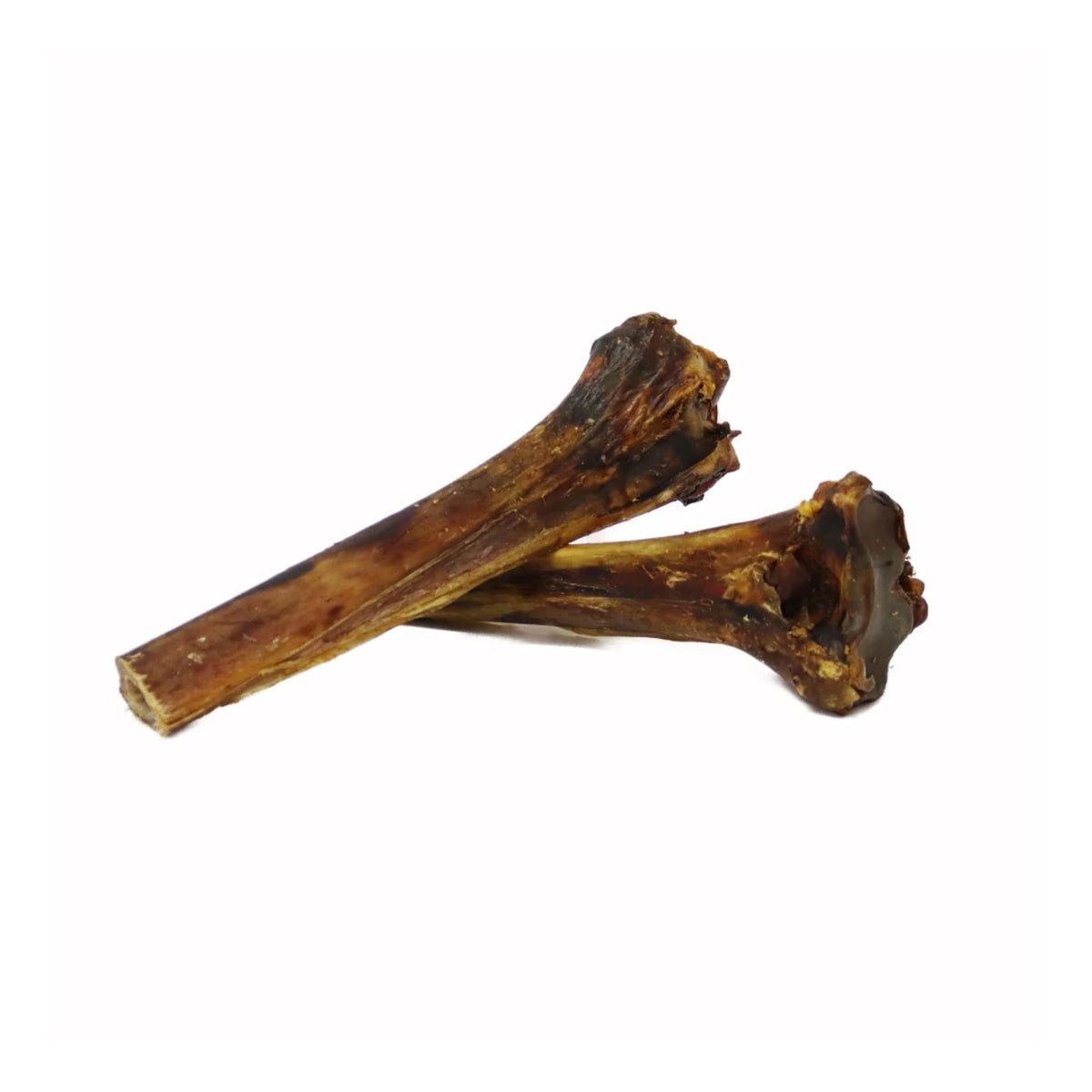 Two air-dried ostrich metatarsus bones for dogs on a white background