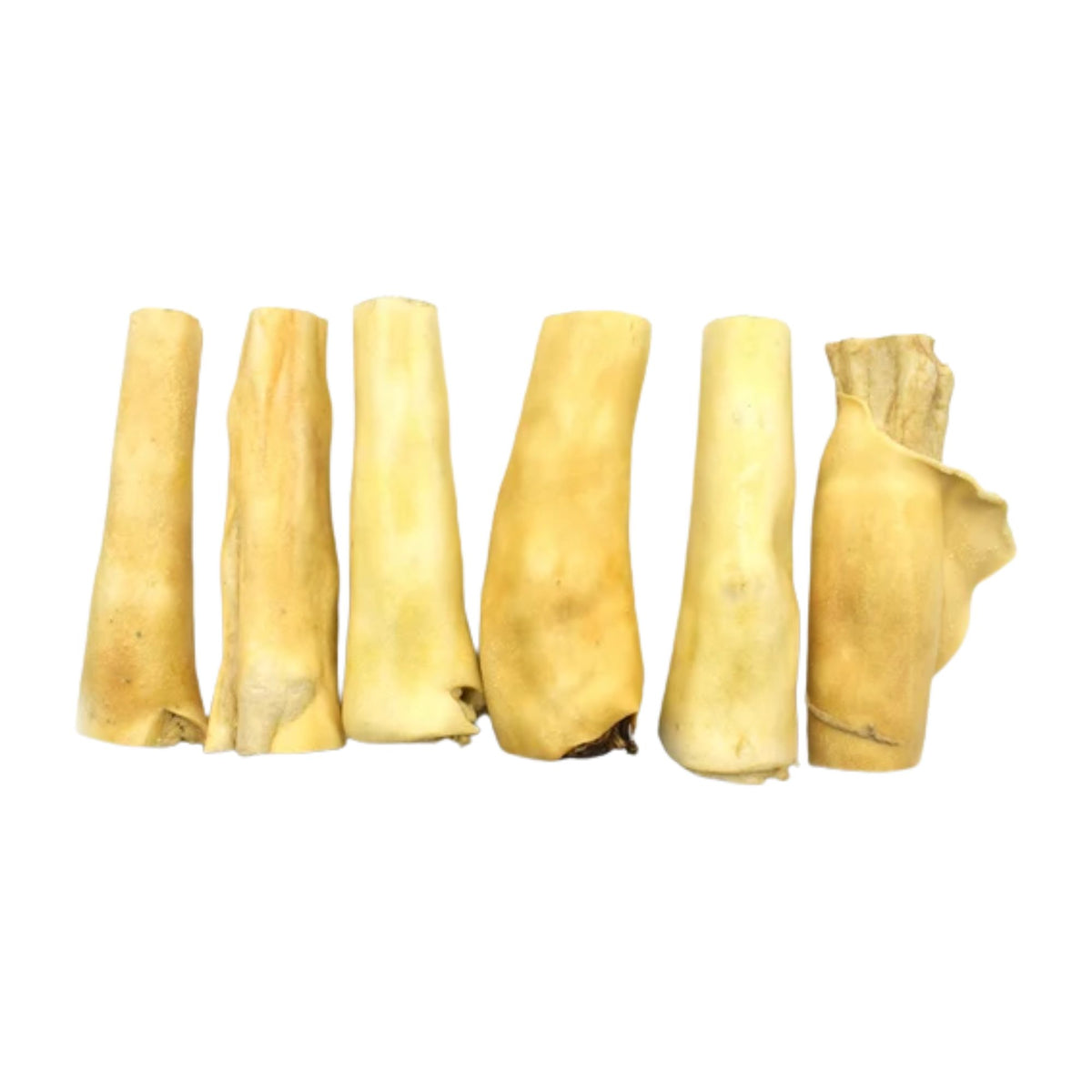 Six jumbo beef tail dog chews in a row on a white background